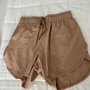 Gold Elite high waisted shorts. Tan size M